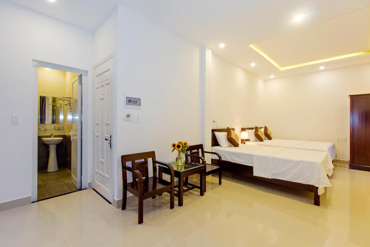 Deluxe Triple Room with Balcony and Garden View