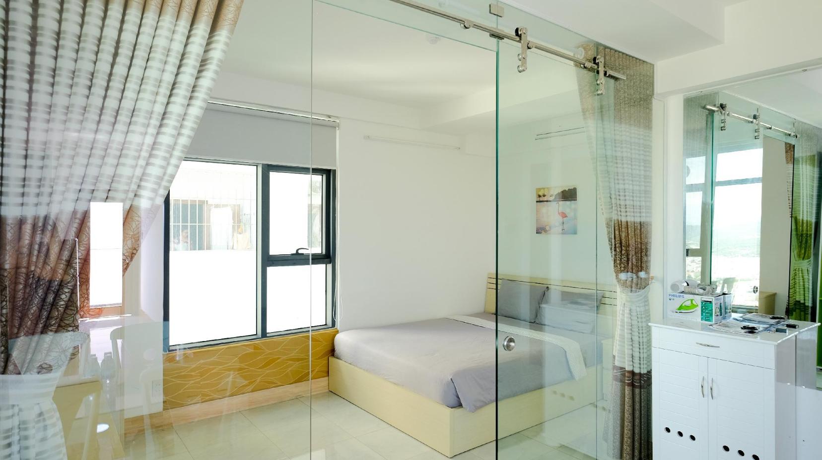 Two-Bedroom Apartment with Balcony and Side Sea View - Bed